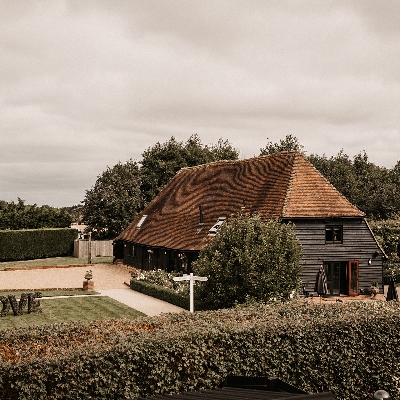 The Old Kent Barn is a 200-year-old oak-framed tythe barn