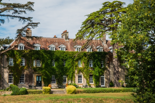 Ivy-covered frontage of Holbrook Manor