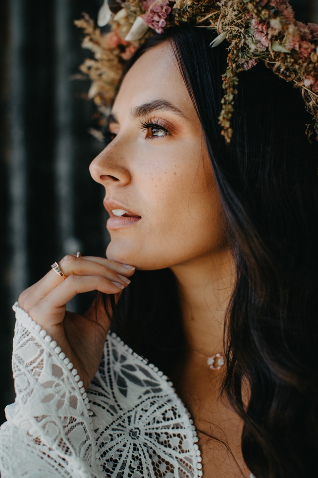 Beautiful boho bride with dark hair and flower crown
