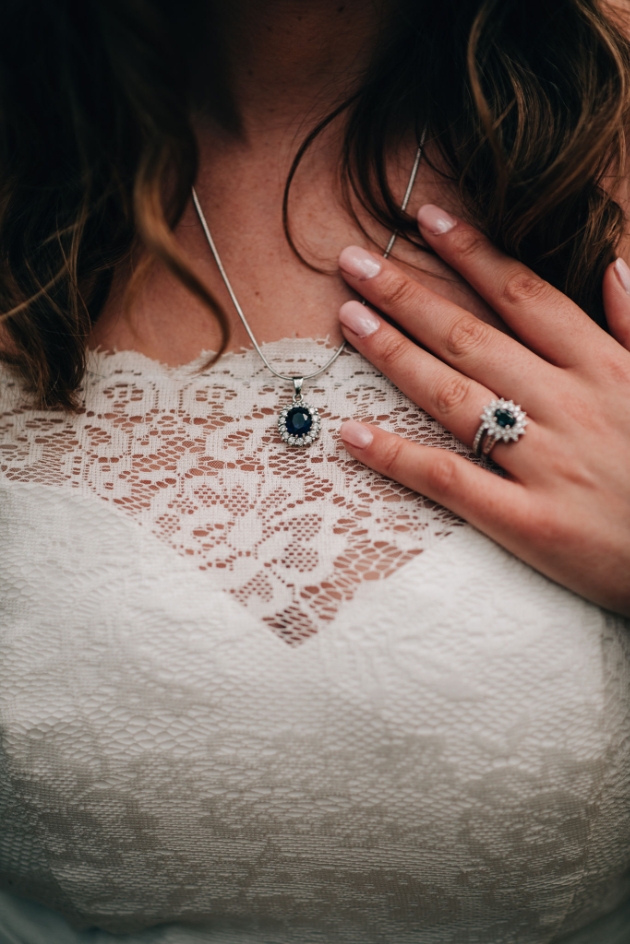 Close up of bride's sapphire and diamond jewellery