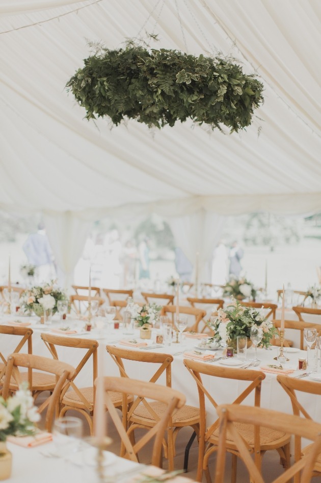 marquee reception with hanging foliage installation