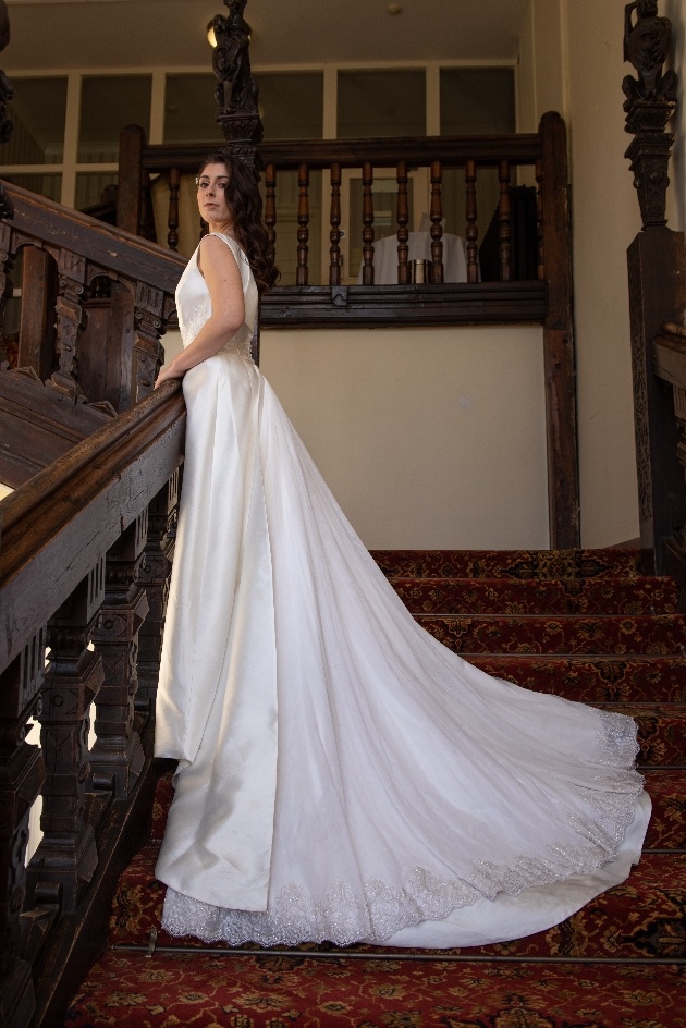 Bride on the stairs at Broome Park