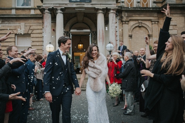 Newlyweds leave their venue in a shower of confetti