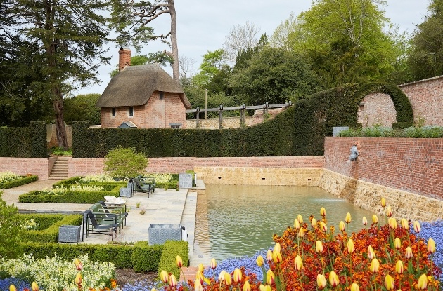 walled garden with pond and flowers