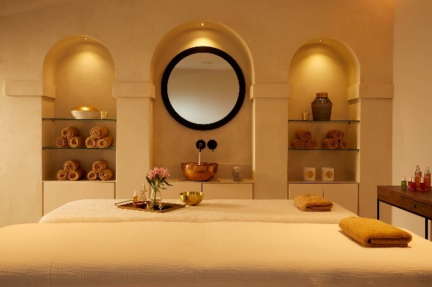 beds in a spa low lighting in room