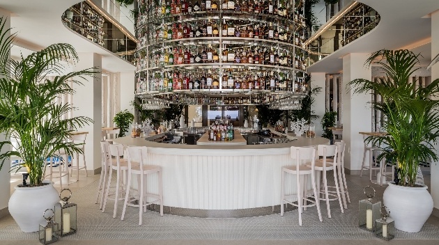 bar image from inside hotel with feature bar rack reaching to ceiling