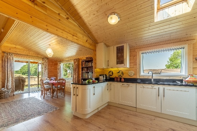 woodne chalet open plan kitchen with table