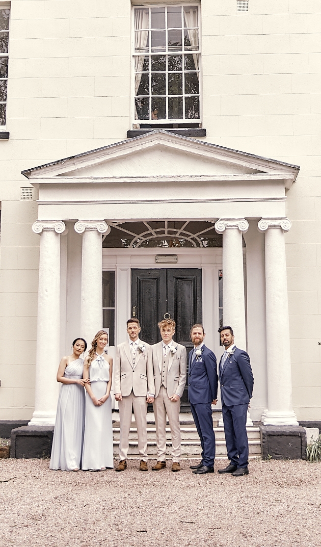 Grooms groomsment and bridesmaids outside the wedding venue Park Manor Cheshire