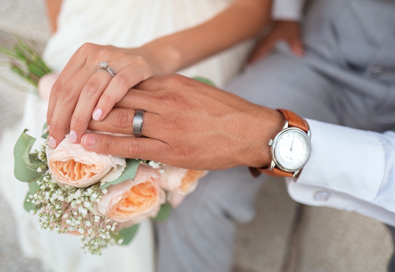 Close up of bride and groom's hands