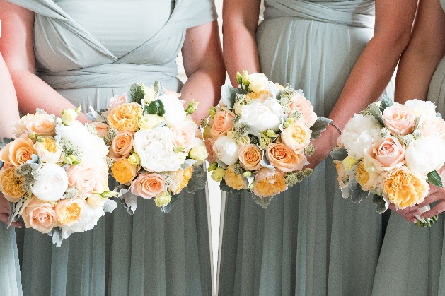 Bridesmaids bouquets in Peach and white by Louise Roots