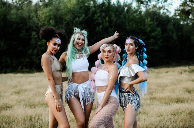 four women in festival outfits ready to celebrate hen party