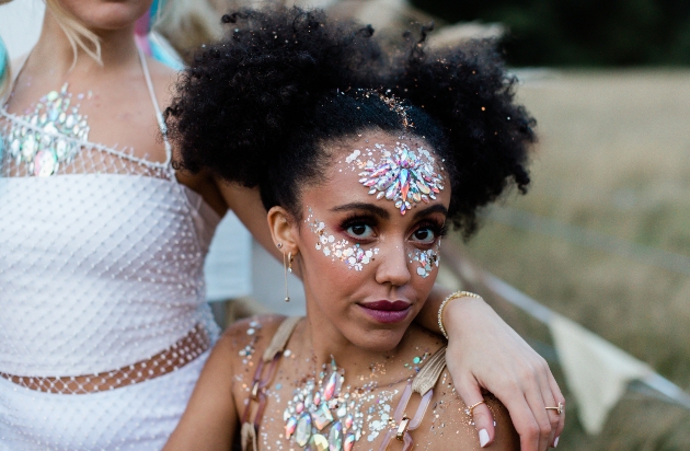 woman wearing glitter makeup and diamante stones