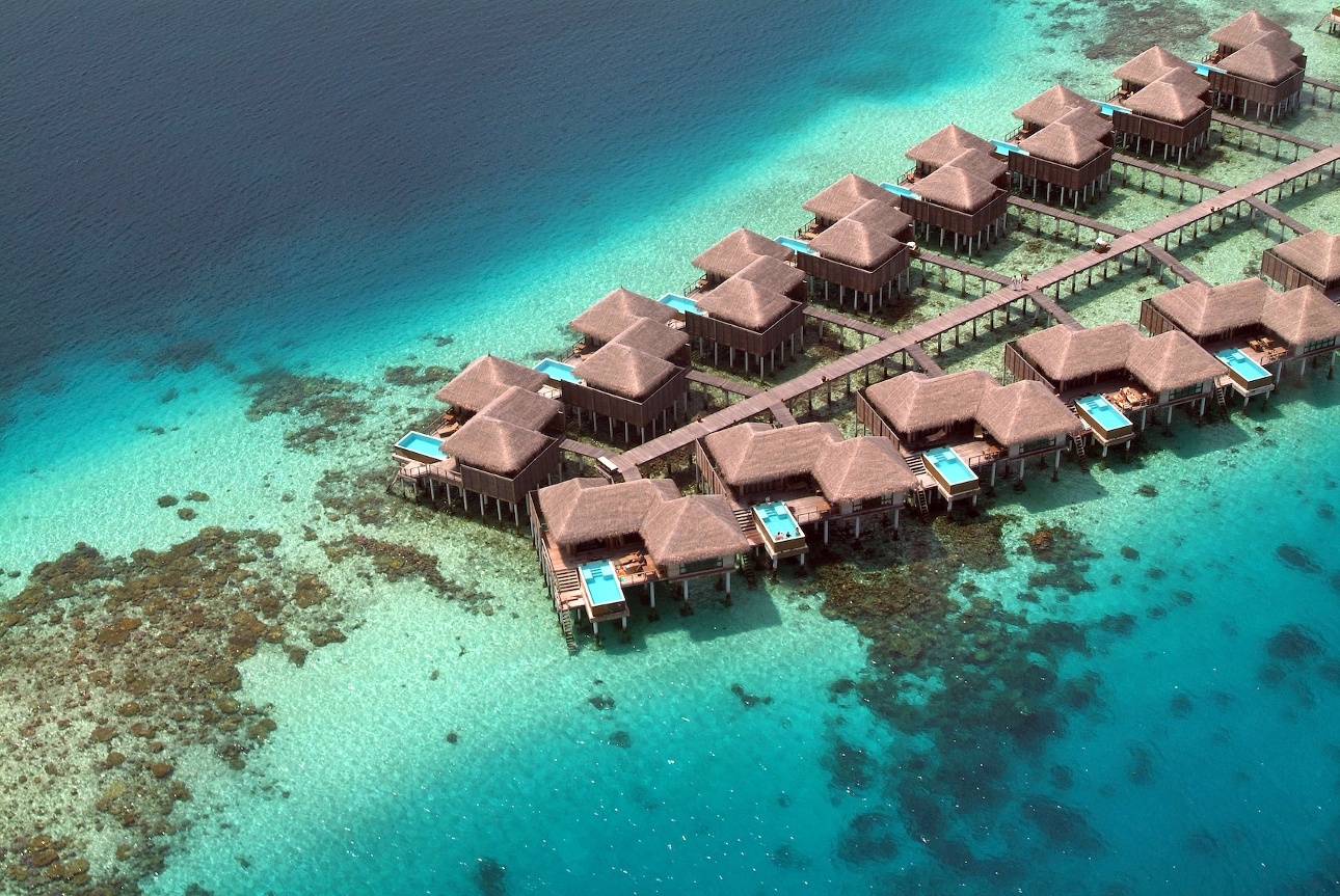 water bungalows in the ocean with pools