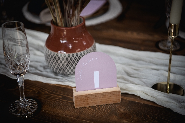 rounded pink table number wedding reception