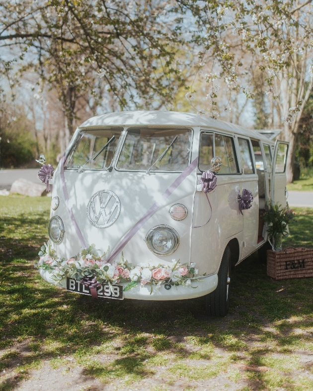 Vintage VW Campervan on the grass decorated in flowers 