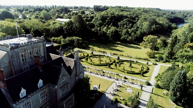 bird's eye view of a manor house and gardens