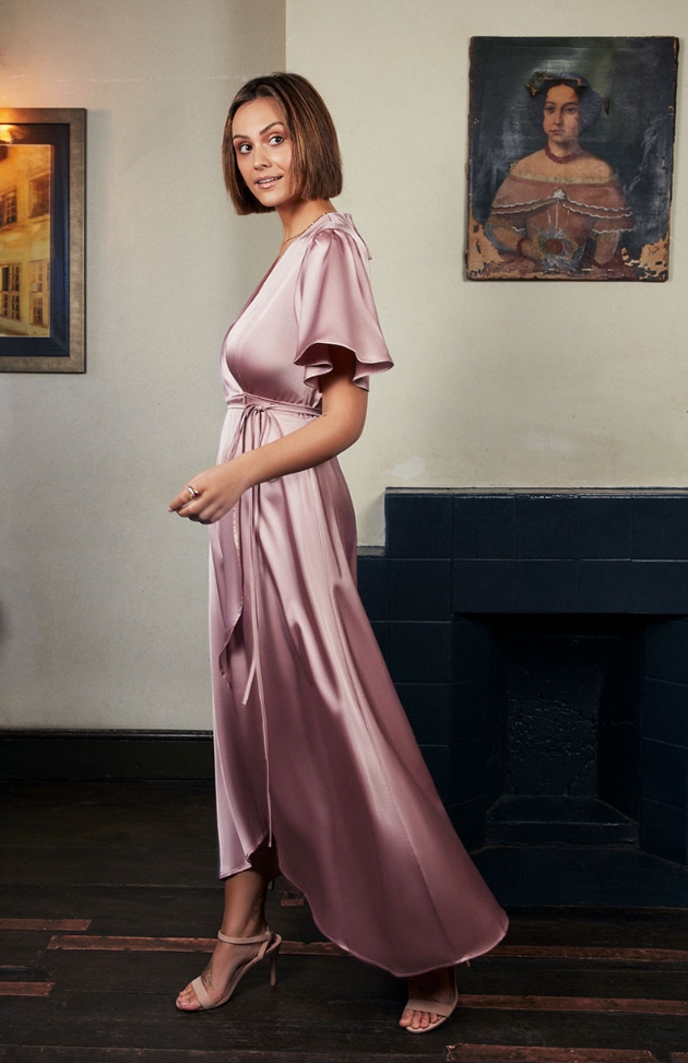 Model wearing a pink Rewritten gown