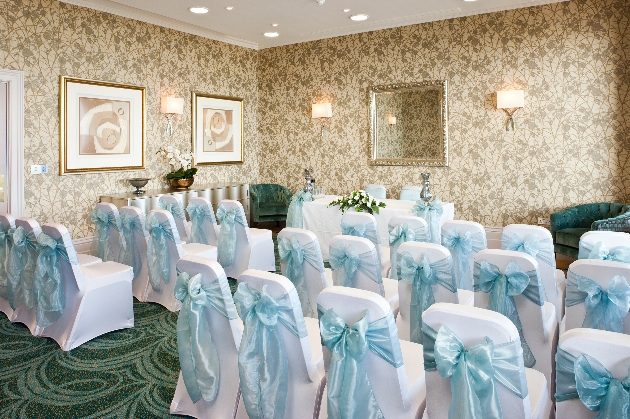 Ceremony room at Dover Marina chairs with light blue sashes