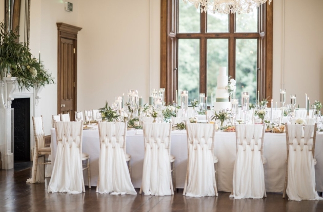 wedding table setting with white sashes 
