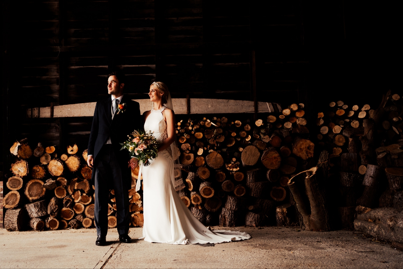 Couple pose in barn