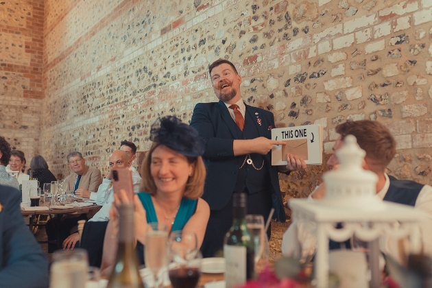 magician at a wedding breakfast with guests at tables