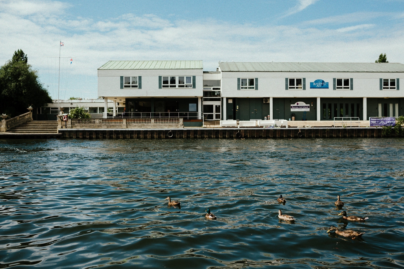 Ravens Ait venue on an island surrounded by water and ducks
