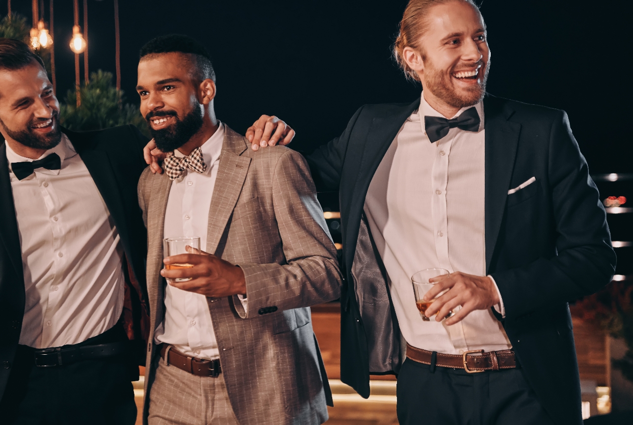 three men in dinner suits with bow ties