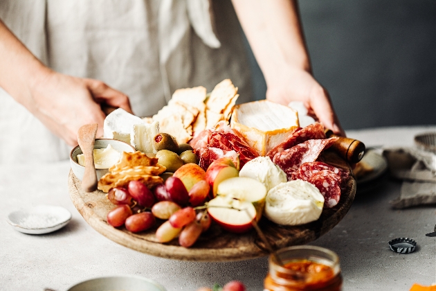 plate of fruit, nuts and italian meats