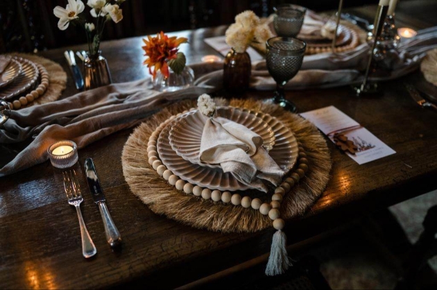 Gorgeous rustic wedding place setting with macrame and rusts