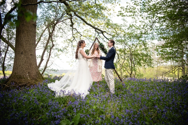 Wedding ceremony amongst the blue bells in the woods