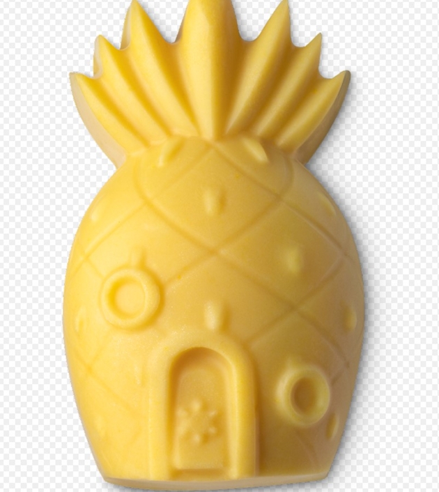 Yellow soap bar in shape of pineapple. 