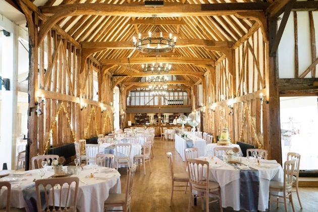 barn style venue with table set up for a reception