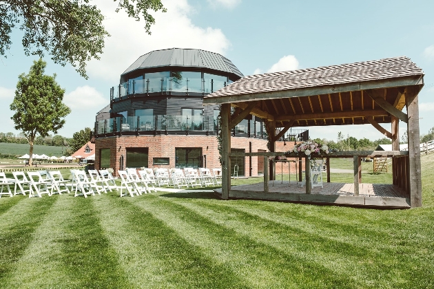 outdoor ceremony area with hotel in background