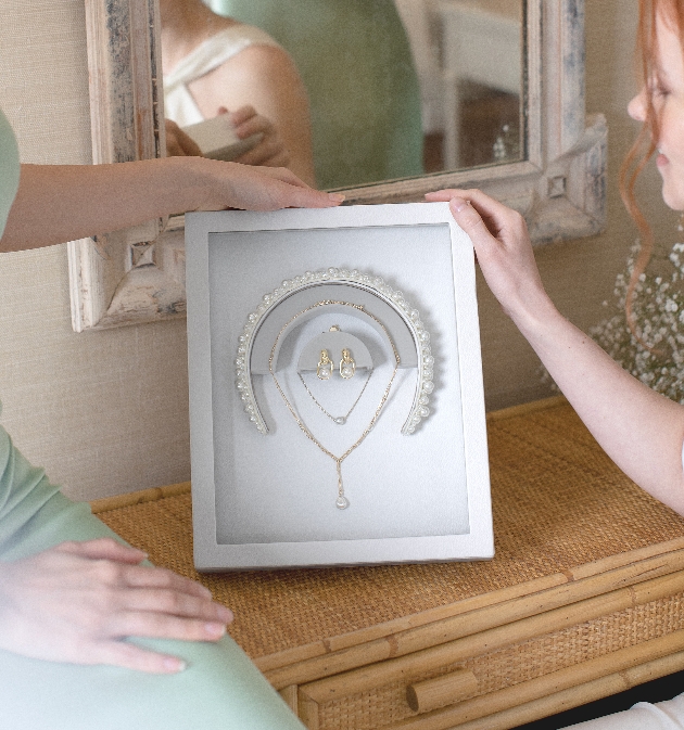 wedding jewellery displayed in a frame