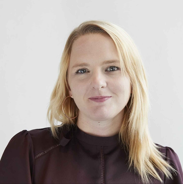 New CEO blonde woman in brown top 