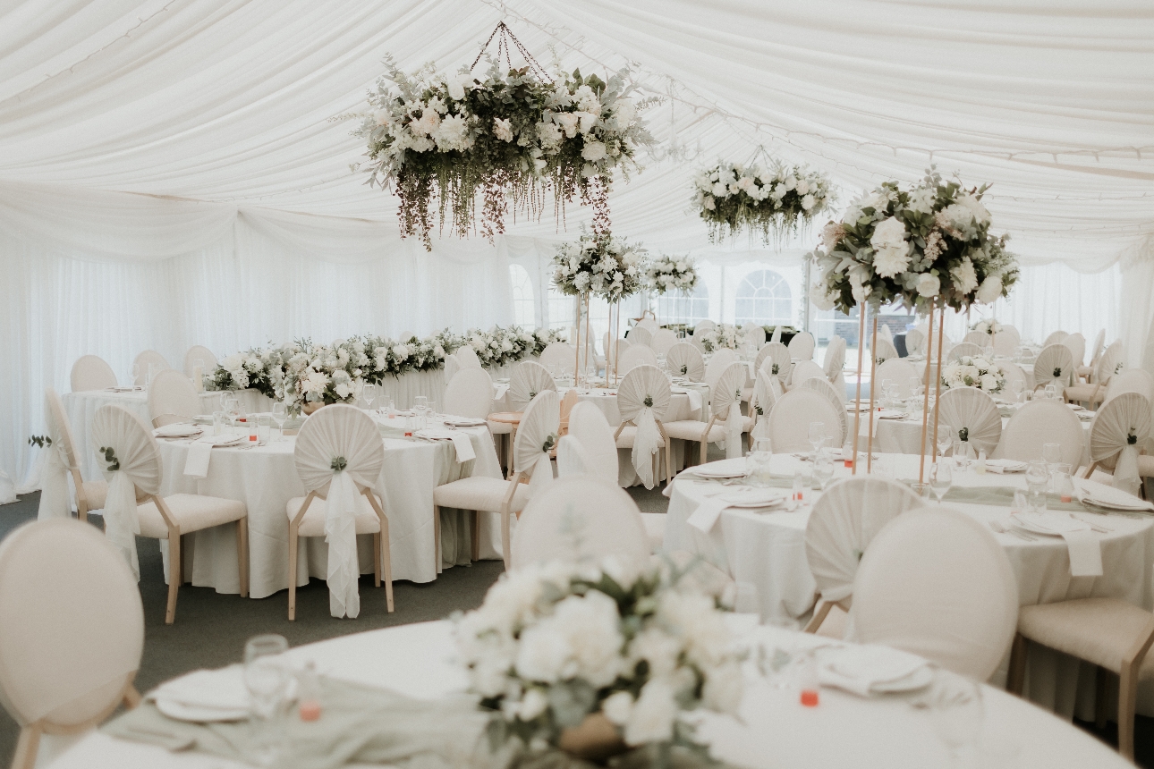 wedding marquee decorated with a white and green decor theme
