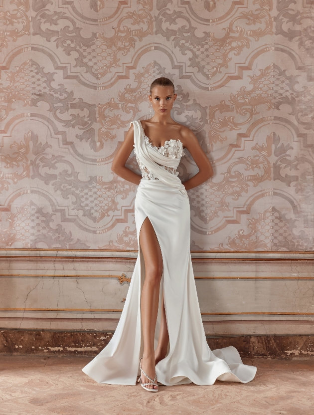 model in one shoulder gown with thigh split