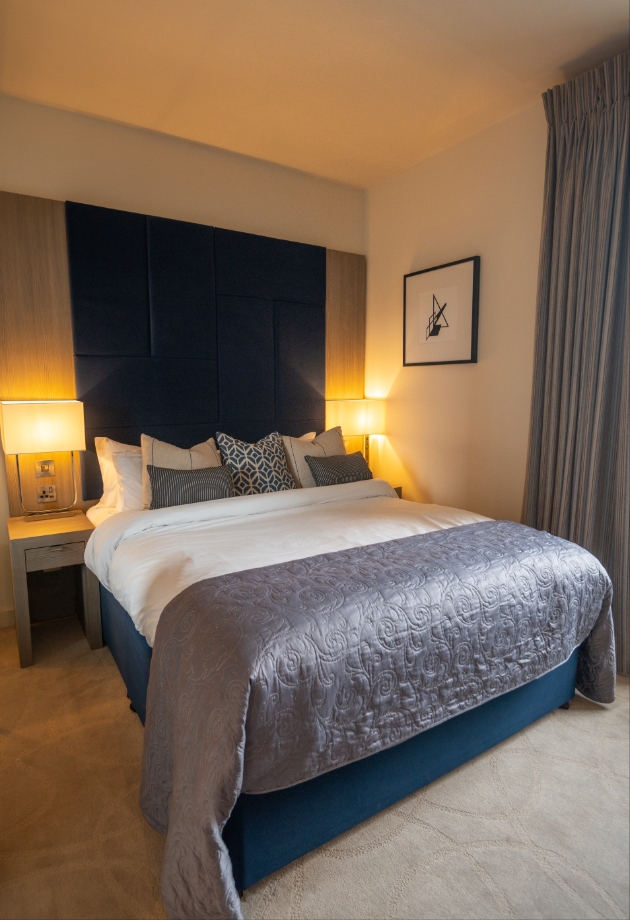 Dunalastair Hotel Suites bedroom with king bed