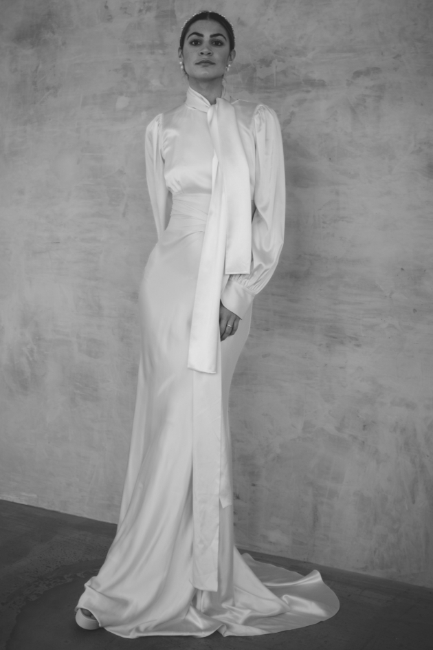 woman in silk dress with high-neck and long sleeves