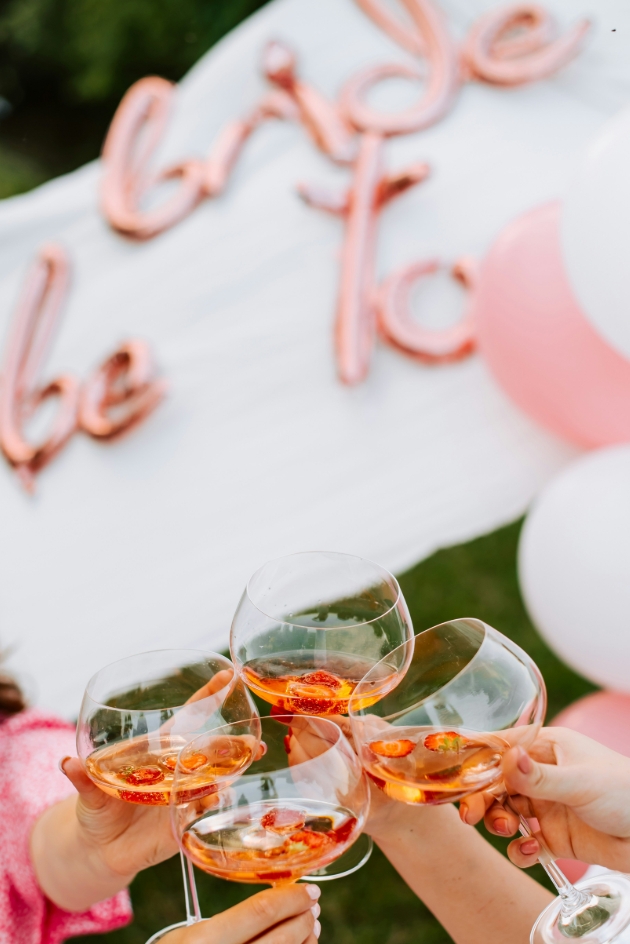 group shot of people clinking glasses together