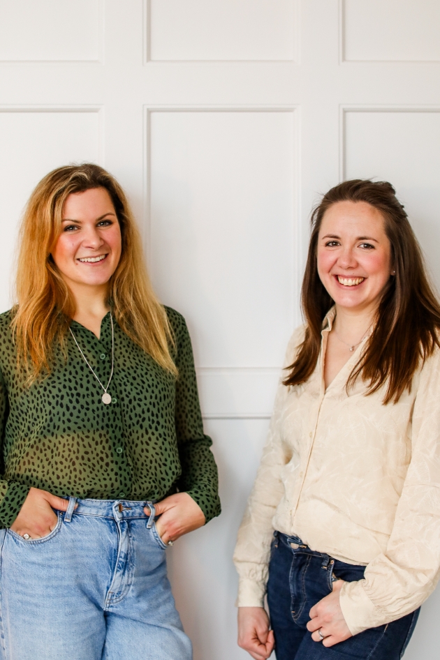 two women posing next to each other 