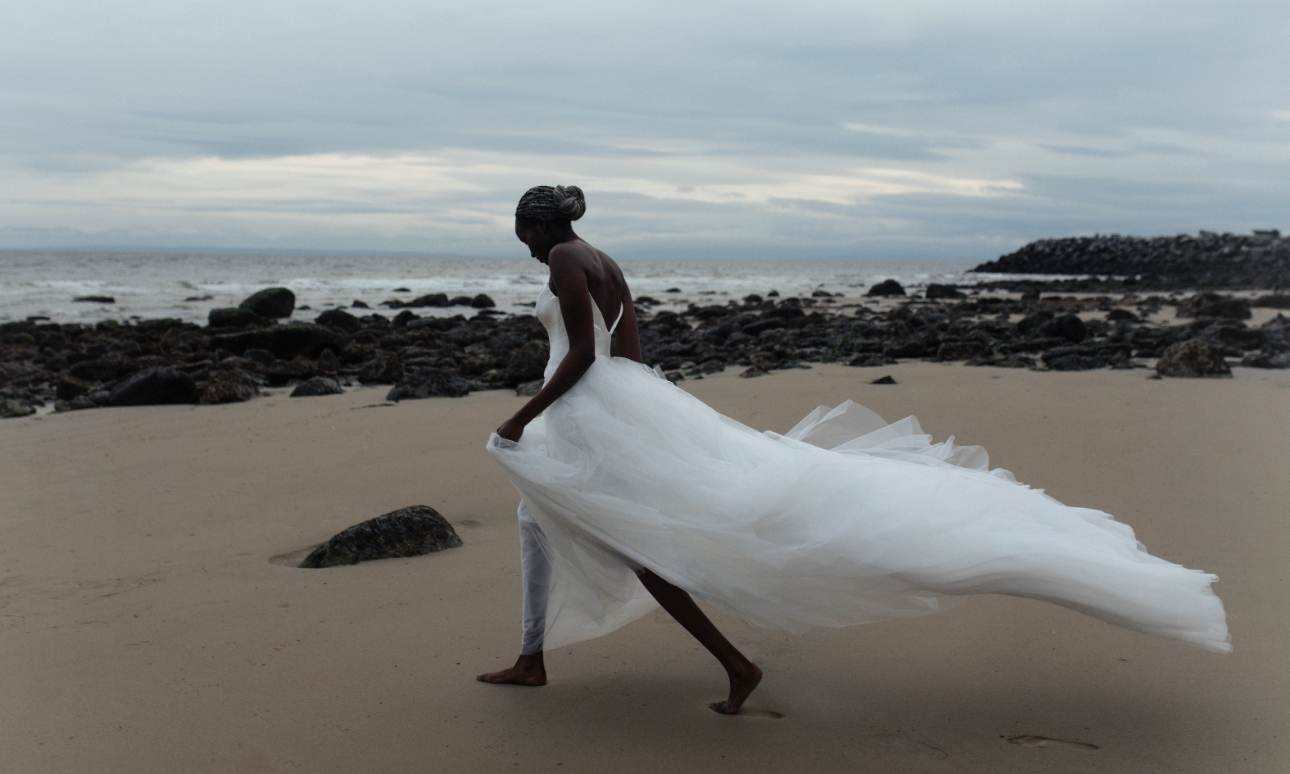 model in white wedding dress, strapless, chiffon skirt