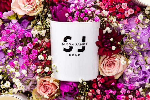 Simon James diffuser surrounded by flowers
